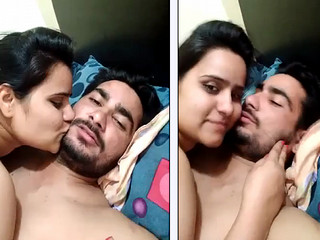 cute couple kissing in bedroom