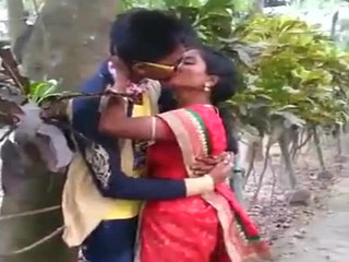 Indian Young lover Couple kissing in park